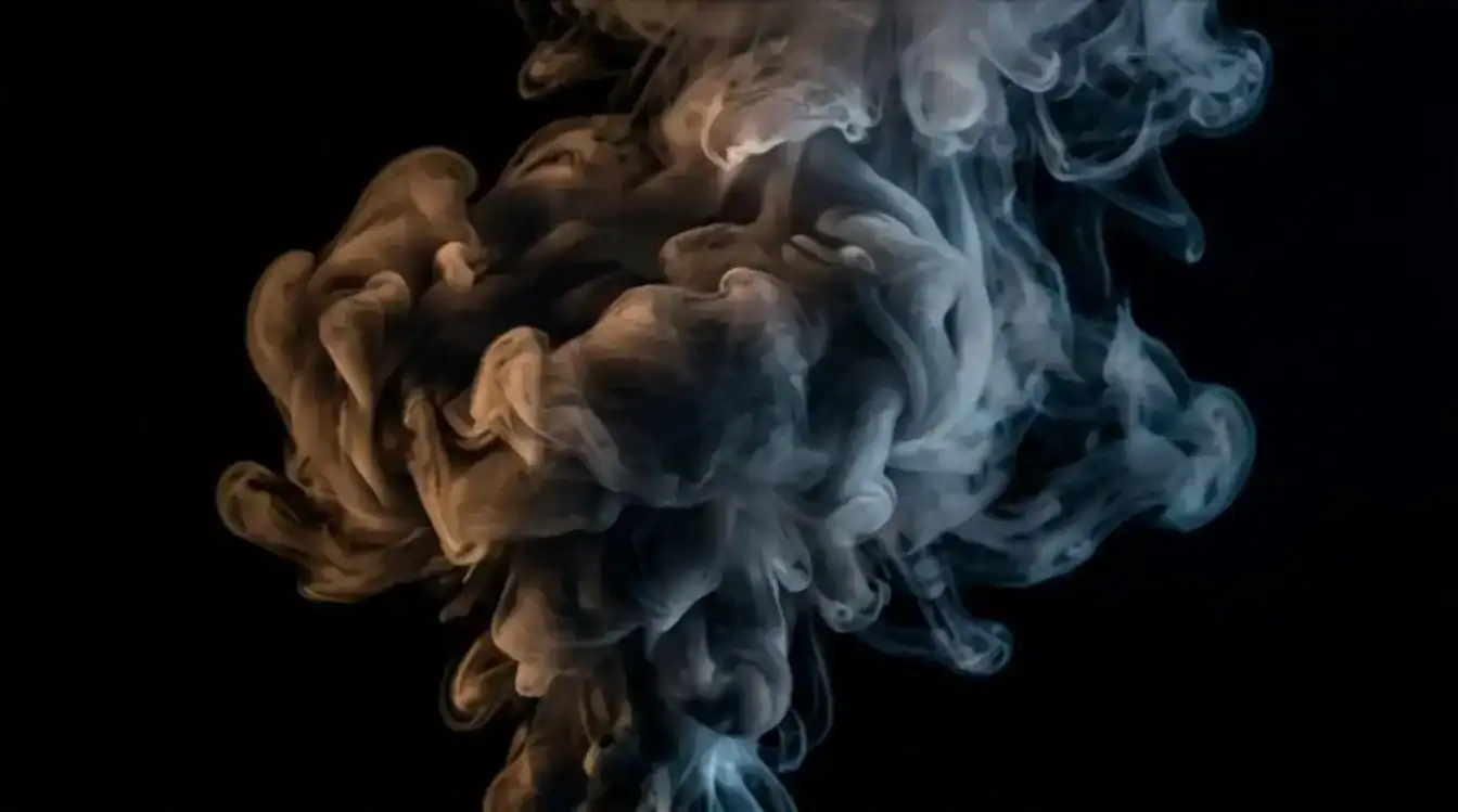 Unnamed vape device producing brown and blue vapor clouds against black background