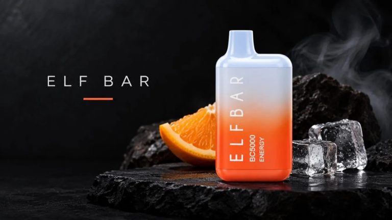 Unnamed vape device with gradient blue to orange finish displayed on black stone with orange slice and ice cubes